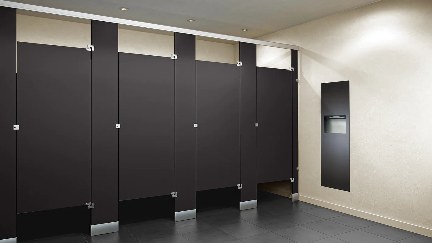 Phenolic color through toilet partitions installed in a commercial restroom