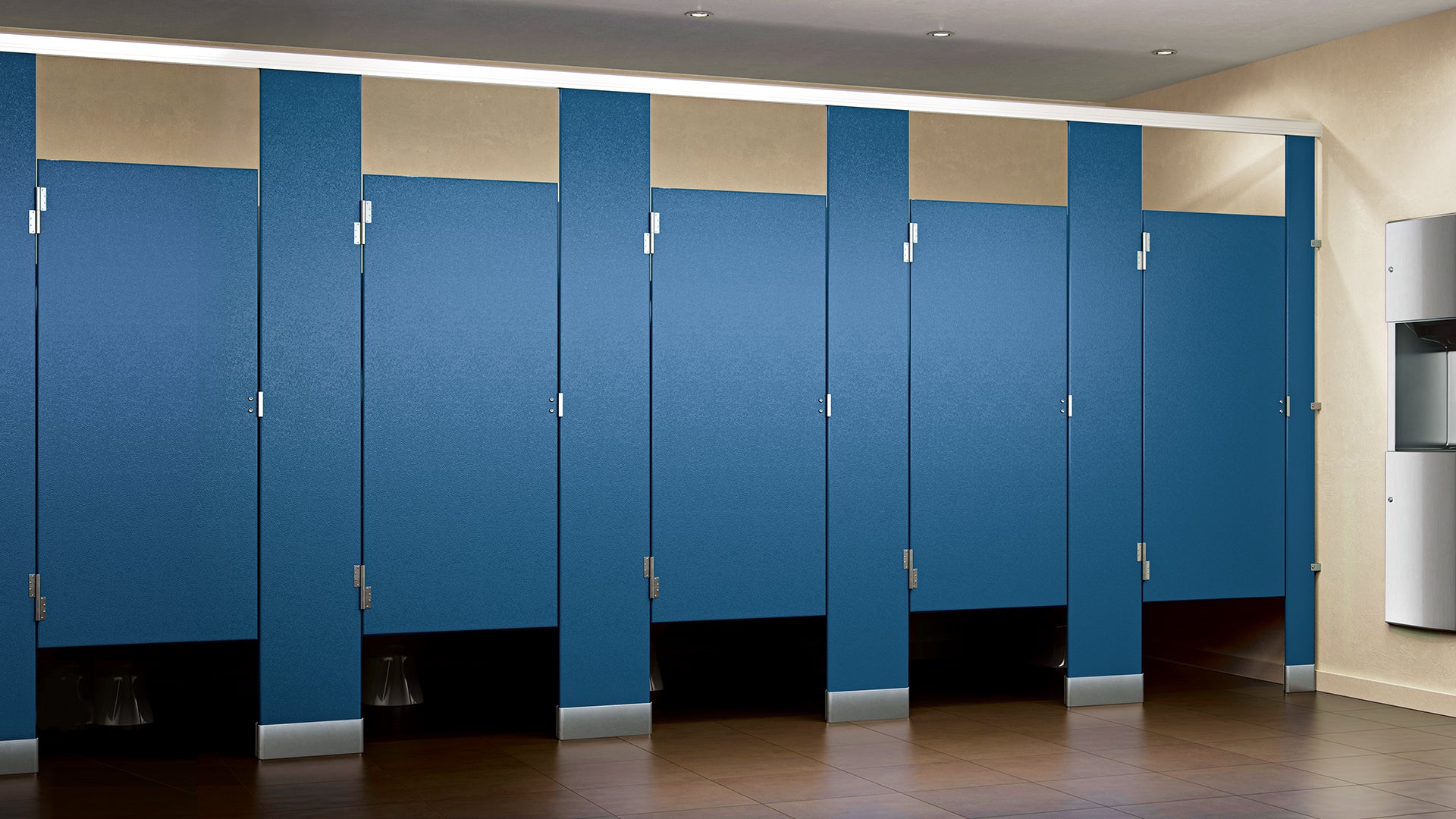 Blue solid plastic (HDPE) toilet partitions in a commercial restroom with floor-to-ceiling panels and tile flooring